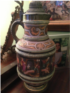 This painted stein, illustrated with people cavorting and carousing in a tavern, is what got Dad doodling.